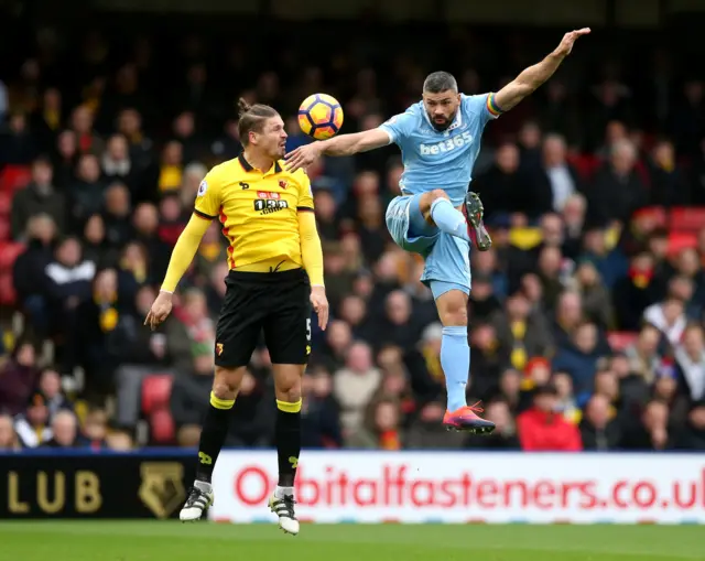 Sebastian Prodl challenges Jonathan Walters