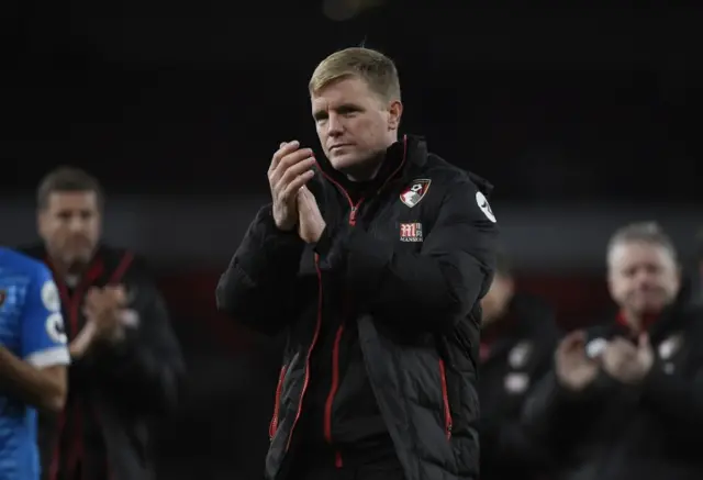 Eddie Howe applauds the fans