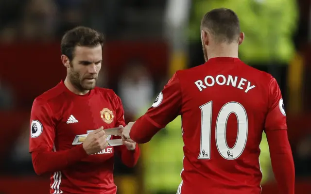 Juan Mata gives Wayne Rooney the captains armband