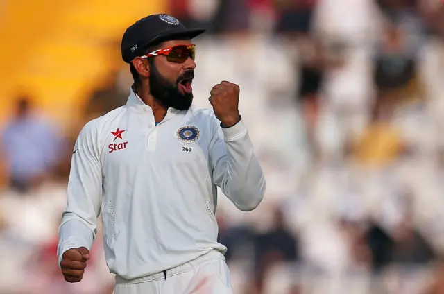 Virat Kohli celebrates the dismissal of England"s Moeen Ali