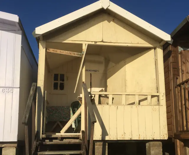 Damaged beach hut