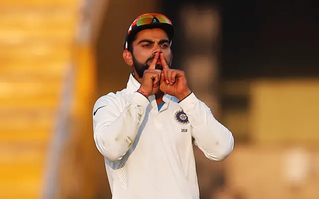 Virat Kohli celebrates