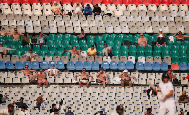 Fans watch the match