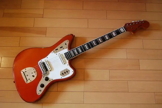 Red Fender Jaguar electric guitar