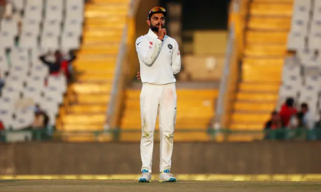 Virat Kohli celebrates the dismissal