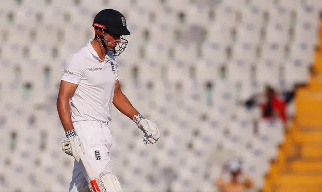 Alastair Cook walks off the field