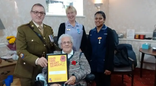 Phil Skawski, county chair of Derbyshire Royal British Legion, resident Freda Walters, Annette Oakes, activity co-ordinator at Milford House and staff nurse Greesha Viswambharan