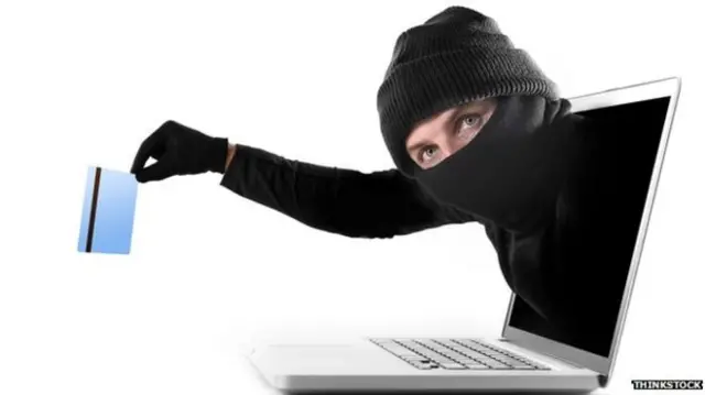 Fraud man coming out of a computer