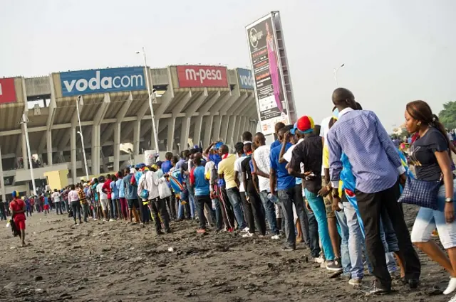 Football fans queuing up to get into a stadium in the DR Congo