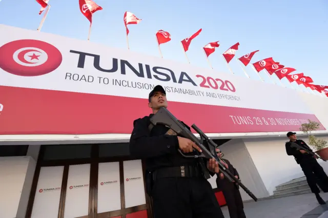 Tunisian security forces stand guard during final preparation at the Congress Palace in the capital Tunis -27 November 2016