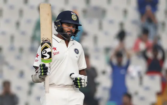 Parthiv Patel raises his bat