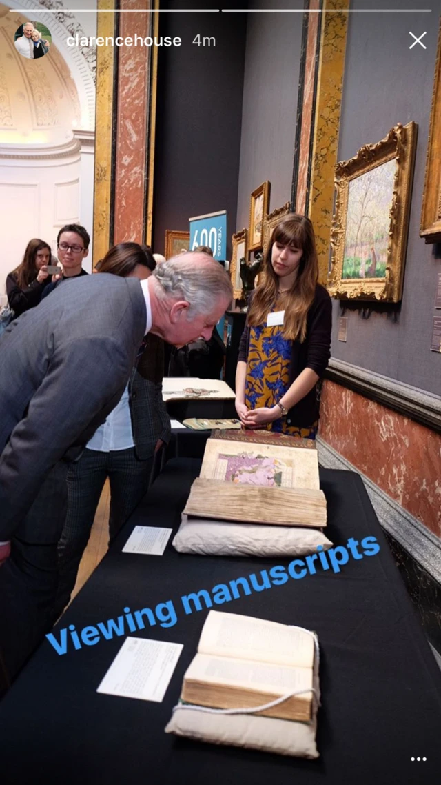 Prince of Wales viewing manuscripts