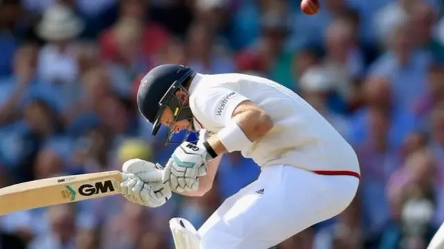 Joe Root ducks under a bouncer