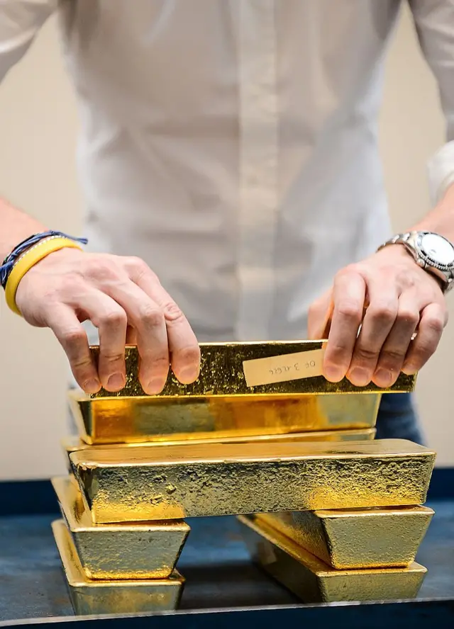 Gold bars stacked on top of one another