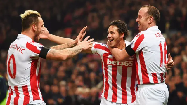 Marko Arnautovic, Ramadan Sobhi and Charlie Adam of Stoke City celebrate