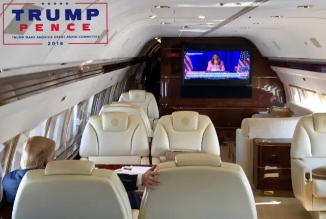 Donald Trump watching his wife Melania's speech on board his campaign plane - 3 November 2016