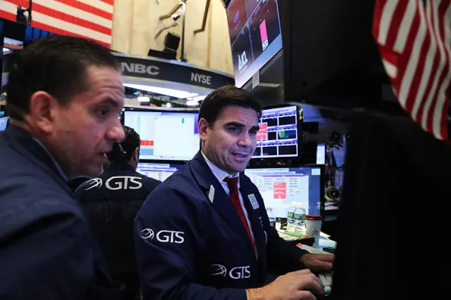 Traders work on the floor of the New York Stock Exchange