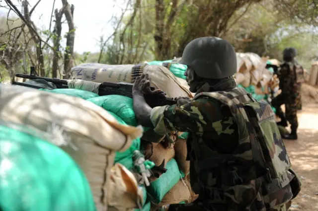 African Union (AU) Burundian soldiers stan post in the town of Elasha Biyaha 20km from the capital Mogadishu on July 24, 2012.