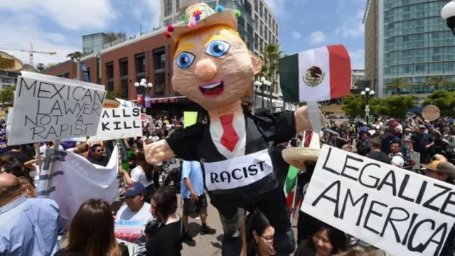 Trump inflatable with 'racist' label