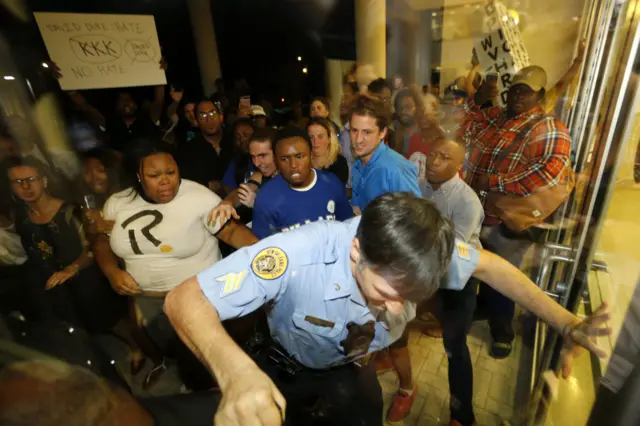 Protesters at New Orleans debate