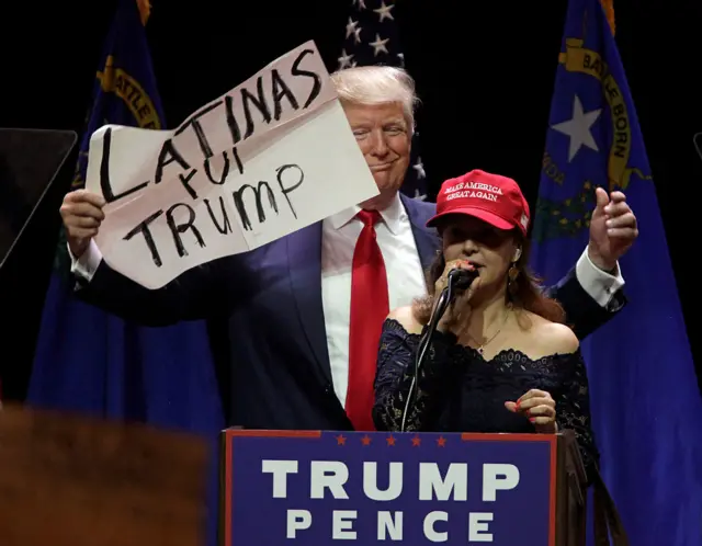 Trump brings a Latina supporter on stage during a rally in Las Vegas