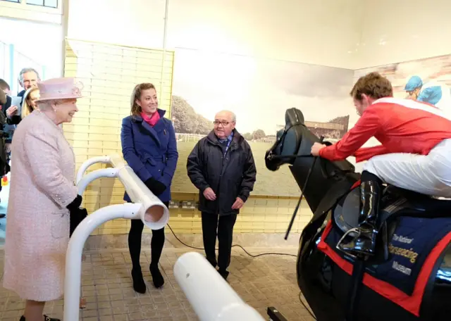 The Queen seeing a horseracing simulation