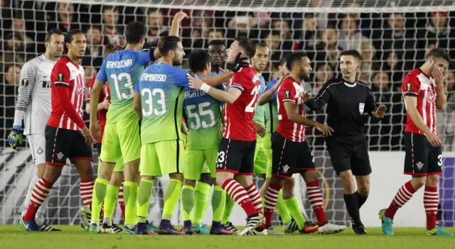 Players from both sides clash after the referee awarded a penalty to Southampton