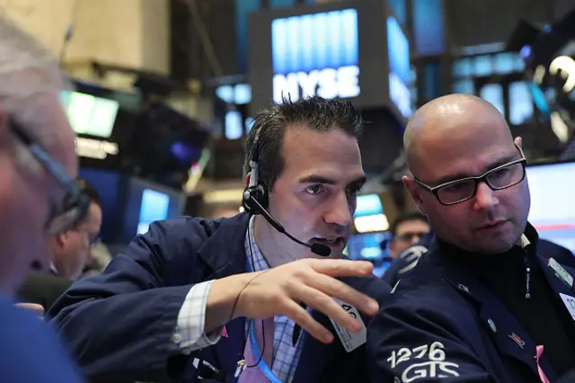 Traders work on the floor of the New York Stock Exchange