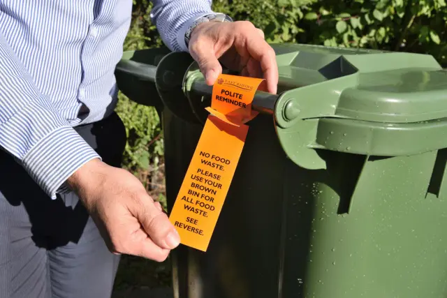 Wheelie bin tag asking people to put food waste in their brown bins