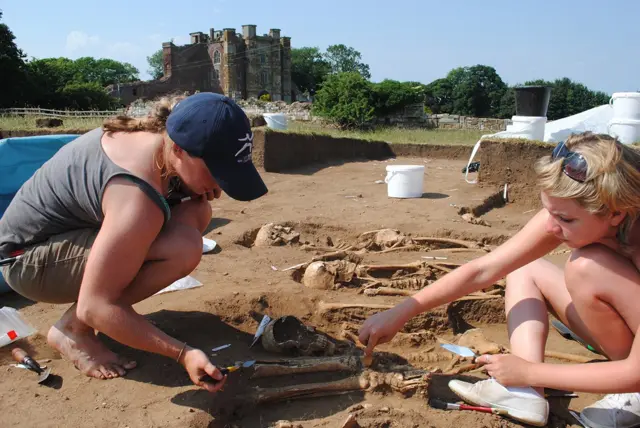 Uncovering bones at dig