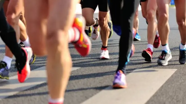 Legs of people running