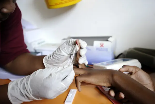 A nurse takes a blood sample on March 8, 2011 in a mobile clinic set up to test students for HIV at Madwaleni high school near Mtubatuba in Kwazulu Natal, South Africa