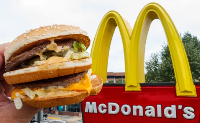 Big Mac in front of McDonald's logo