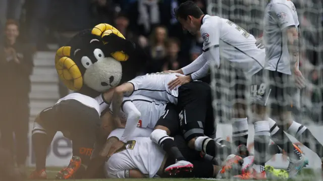 Derby celebrate a goal against Wolves