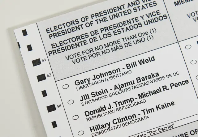 An absentee ballot featuring voting options for the US presidential election, including Republican presidential nominee Donald Trump and Democratic presidential nominee Hillary Clinton, among others, is seen in Washington, DC.