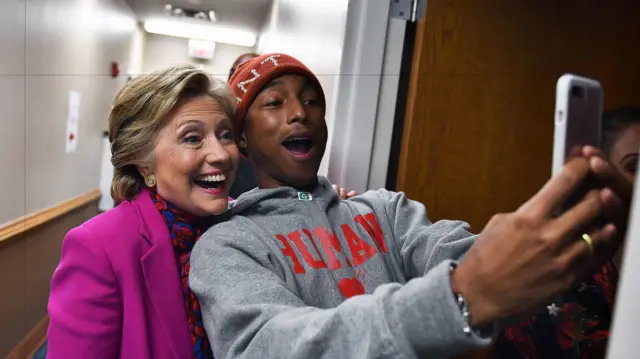 Pharrell Williams takes selfie with Hillary Clinton