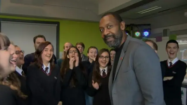 Lenny Henry with school pupils