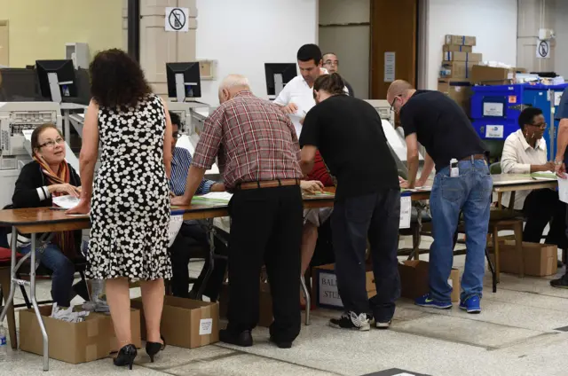 South Florida voters register at an early voting polling centre in Miami