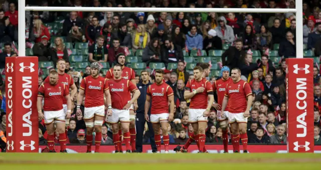 Wales' players react