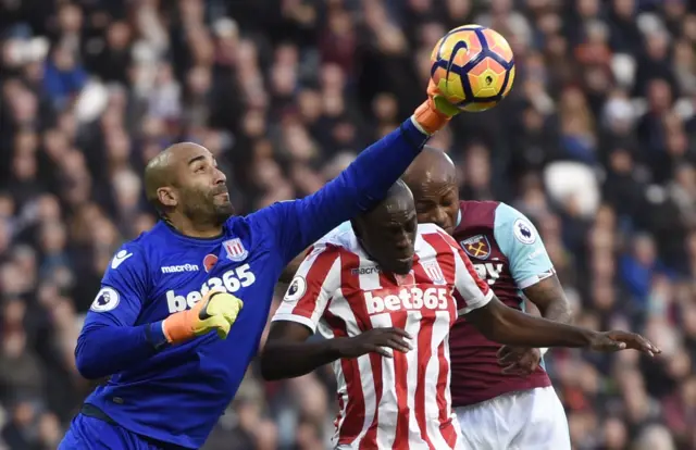 Lee Grant punches the ball away for Stoke