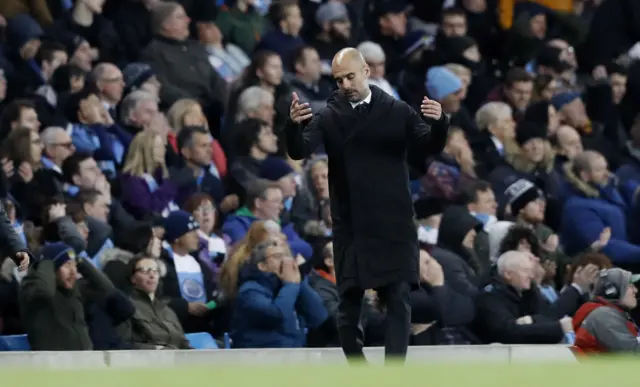 Manchester City manager Pep Guardiola looks dejected