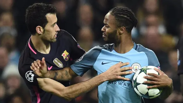 Sergio Busquets and Raheem Sterling