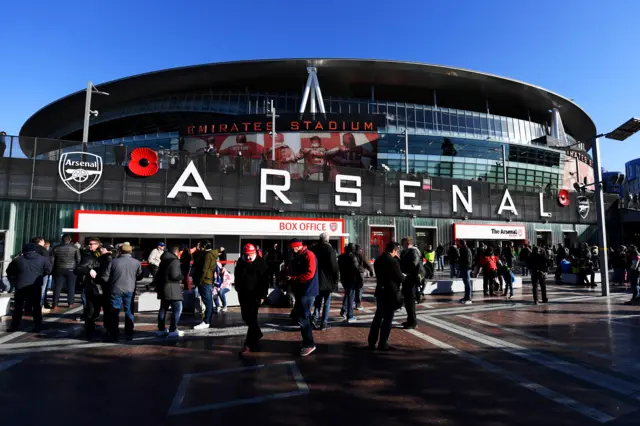 Fans arrive at the stadium