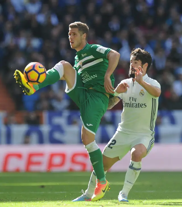 Ruben Perez of Leganes controls the ball while being challenged by Isco of Real Madrid