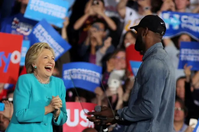 NBA basketball player Lebron James (R) introduces U.S. Democratic presidential nominee Hillary Clinton