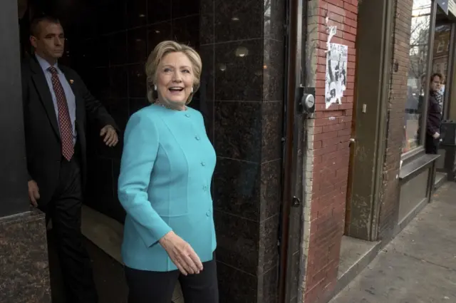 Democratic presidential candidate Hillary Clinton steps outside after greeting patrons at Cedar Park Cafe in Philadelphia, Sunday, Nov. 6, 2016.