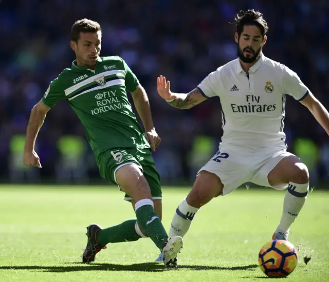 Real Madrid's midfielder Isco with Leganes' midfielder Alberto Martin