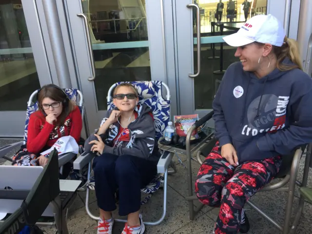 Riley Visner appears with her two children at a rally for Republican nominee Donald Trump in Grand Rapids, Michigan.