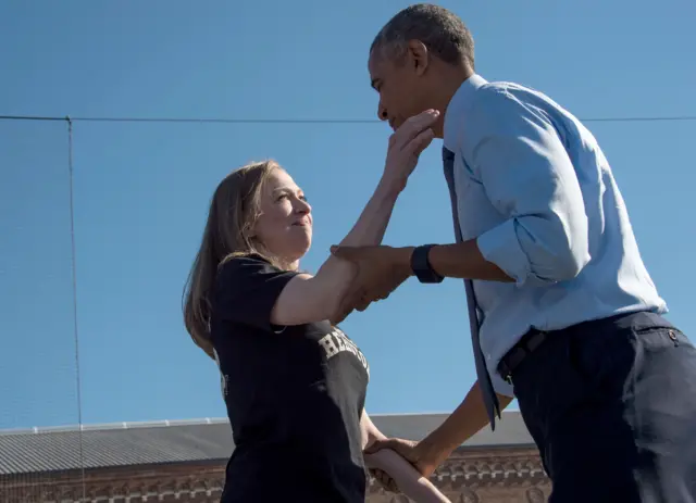 US President Barack Obama greets Chelsea Clinton in Ann Arbor, Michigan