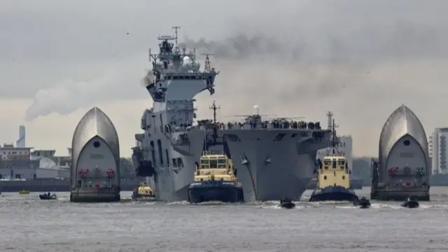 HMS Ocean passing through the Thames Barrier in 2012.